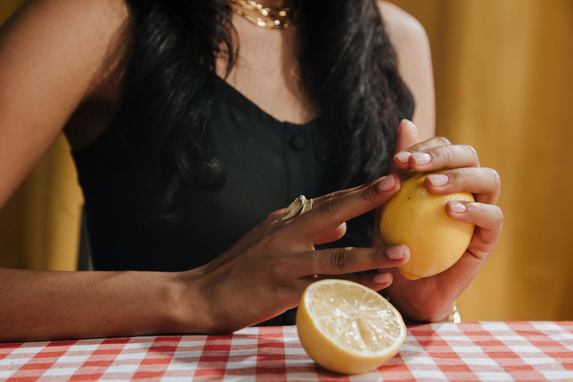 Woman holding modern silicone vibrators, considering pleasure options