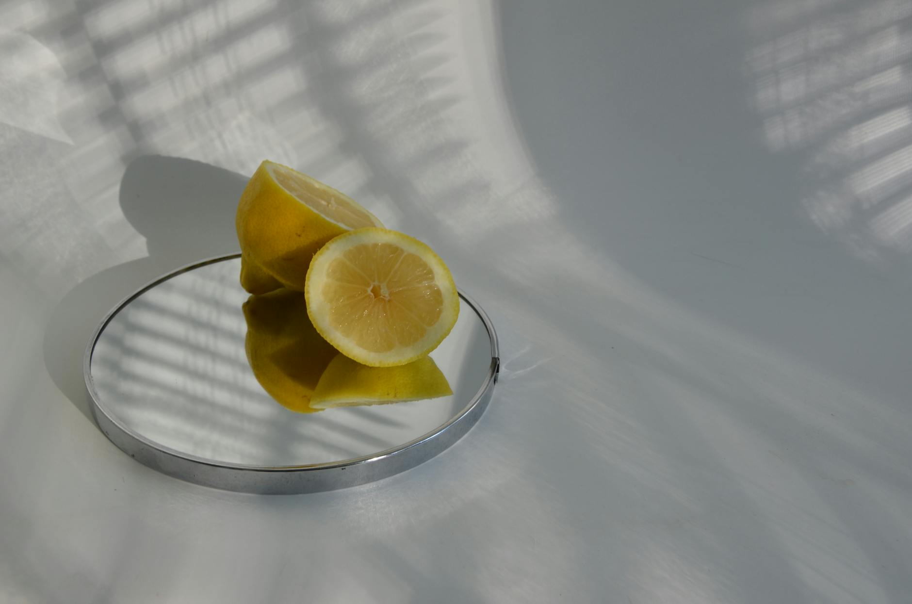Close-up of hands holding a blue personal massager against a knitted sweater.