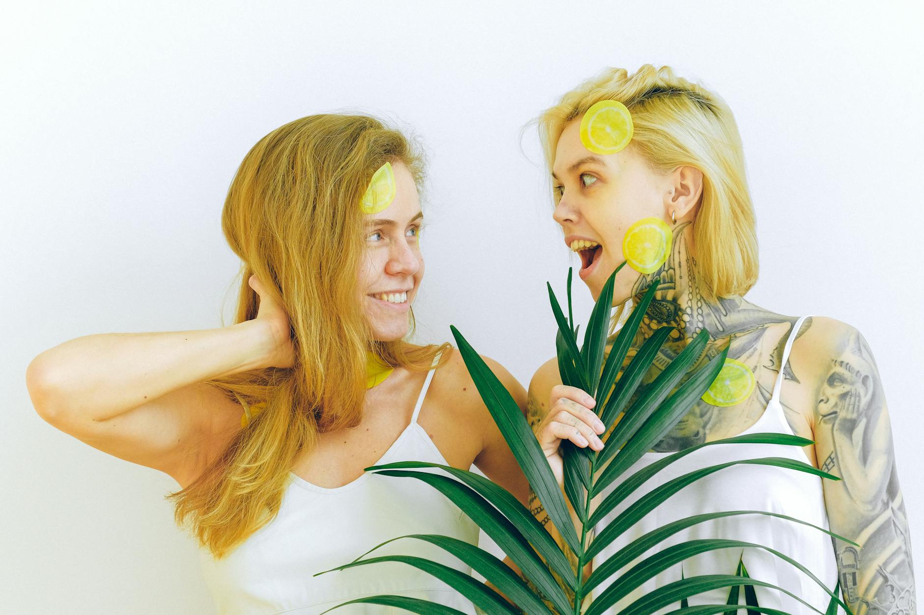 A couple standing together, holding a blue vibrator, exploring new ways to connect